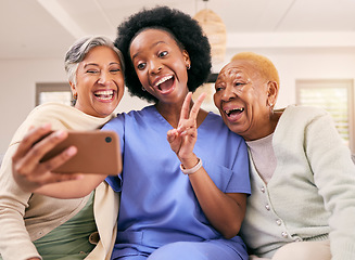 Image showing Selfie, caregiver and senior women with peace sign for social media, online post or profile picture on sofa. Retirement, nursing home and nurse with elderly people take photo for happy memories