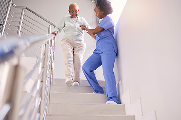 Image showing Steps, nurse and help elderly woman, holding hands and assistance in home. Caregiver, stairs and senior African patient walking down, support of person with a disability and kindness in healthcare