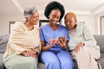 Image showing Phone, caregiver and senior women on sofa to browse internet, telehealth and mobile app together. Retirement, nursing home and nurse with elderly people on smartphone for medical result or report