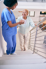 Image showing Caregiver, stairs and elderly woman holding hands, help and assistance in home. Nurse, steps and senior African patient walking up, support of person with a disability and happiness in healthcare