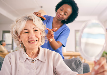 Image showing Caregiver brush hair of happy senior woman in the living room of the modern retirement home for self care. Mirror, routine and African female nurse doing a hairstyle for an elderly patient in lounge.