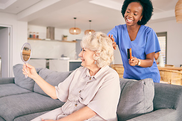 Image showing Caregiver brush hair of senior woman in the living room of the modern retirement home for self care. Mirror, routine and African female nurse doing a hairstyle for an elderly patient in the lounge.