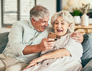 Image showing Relax, phone and funny with old couple on sofa for streaming, social media and communication. Excited, internet and website with senior man and woman laughing in living room at home for news and app