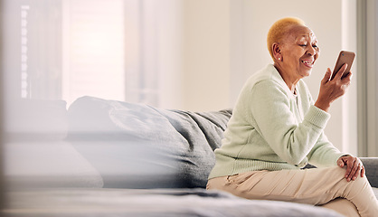 Image showing Video call, senior woman audio and living room with conversation and communication in a home. Retirement, African elderly female person and mobile discussion on a sofa with contact and mockup space