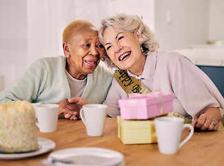 Image showing Senior women, birthday celebration and party event at a home with a present and friends gift. Surprise, happy singing and retirement of elderly people at a dining room table together with a smile