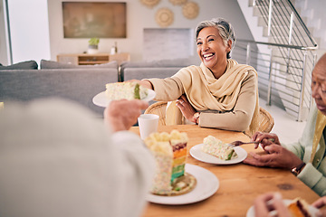 Image showing Happy, cake and senior friends at a home for a tea party having fun together in retirement. Smile, happiness and elderly female person dish dessert or sweet snack by the dining room table at home.