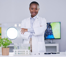 Image showing Black woman, portrait and scientist with arms crossed in lab, office and confidence for biotechnology research or work. Science, laboratory and expert with innovation in African plants or biology