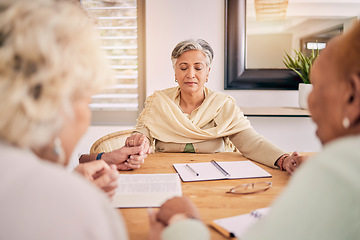 Image showing Senior people, group prayer and holding hands at table together, support and worship Holy Spirit, Jesus Christ and God. Elderly friends, religion and gratitude in home, hope and spiritual faith.