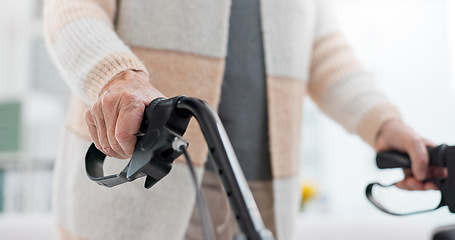 Image showing Hands, walking aid and a senior person with a disability in recover or rehabilitation in a clinic for mobility. Healthcare, medical and physiotherapy with an elderly patient in a nursing home