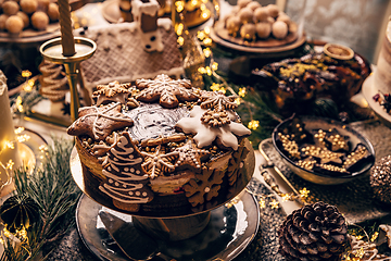 Image showing Fancy table fulfilled with Christmas desserts