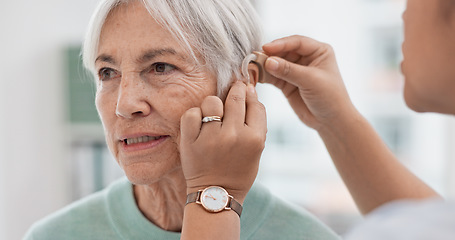 Image showing Old woman, doctor hands and patient with hearing aid, help and support with healthcare in clinic. Person with disability, deaf and people, trust and communication, health insurance and medical