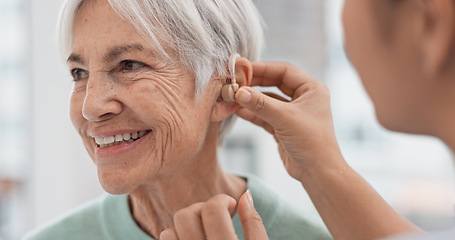 Image showing Old woman, doctor hands and patient with hearing aid, help and support with healthcare in clinic. Person with disability, deaf and people, trust and communication, health insurance and medical