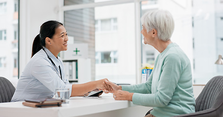 Image showing Doctor handshake, senior woman and healthcare with thank you in a hospital for medical care. Elderly consultation, smile and insurance conversation with women in a clinic office for retirement advice