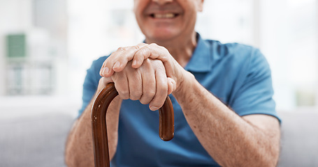 Image showing Walking stick, hands and happy elderly man with wooden cane on sofa for balance, support and mobility. Walk, aid and old male at senior care facility with disability, dementia or chronic arthritis