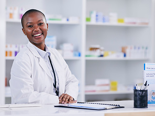 Image showing Pharmacist portrait, woman and counter for healthcare, medicine and clinic solution, services and support. Happy african person in pharmacy for drugs, medical product and inventory or retail mindset