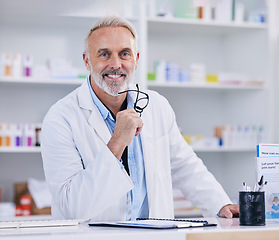 Image showing Pharmacy, consulting and smile with portrait of man for medical, pills and helping. Medicine, healthcare and manager with mature pharmacist in dispensary store for retail, supplements or prescription