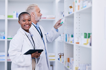 Image showing Tablet, portrait and pharmacists checking medication for inventory, stock or medical research. Healthcare, medicine and senior chemist mentor teaching female pharmaceutical student with technology.