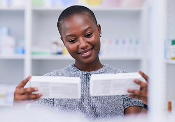 Image showing Pharmacy, product choice and happy black woman, customer or client reading package, box or pharmaceutical label. Hospital clinic store, supplements pills or African person smile for medicine decision