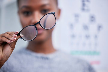 Image showing Optometry, eyesight and black woman with glasses for vision, eye care and optical health in clinic. Healthcare, optometrist and person with prescription lens, frames and spectacles for testing eyes