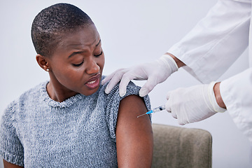 Image showing Flu shot, black woman or patient with vaccine, needle or healthcare with treatment, cure or hands. Arm, person or lady with doctor, injection or medication with vaccination, consultation or syringe