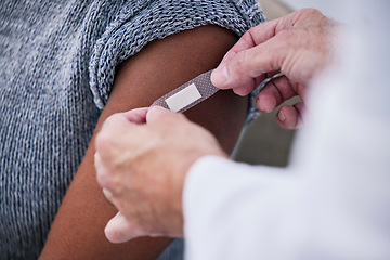 Image showing Vaccine, plaster and doctor hands with patient for healthcare consultation, hospital first aid or medical support service. Pharmacy clinic nurse, closeup arm or pharmacist helping person with bandage