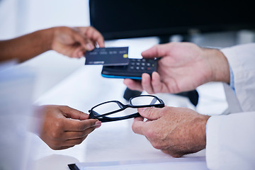 Image showing Shopping, glasses and payment with hands of people in store for medical, retail and eye care. Medicine, healthcare and credit card with closeup of doctor and customer for purchase and fintech