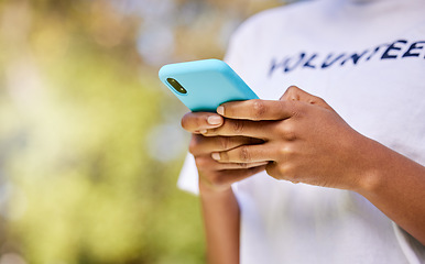 Image showing Person hands, phone and volunteering in nature with social media FAQ, blog or community service networking. Volunteer on mobile or chat for earth day communication, NGO or nonprofit contact in park