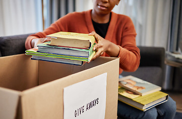 Image showing Donation box, charity and woman with books for nonprofit and cardboard container at home. Education textbook, donating and house with giveaway and spring cleaning for community support with packing