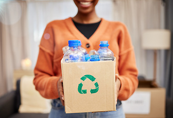 Image showing Plastic, recycle and woman with bottle in box in living room for eco friendly, reusable and cleaning. Sustainability, conservation and happy person with container to reduce waste, litter and garbage