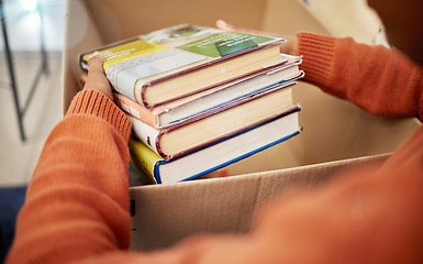 Image showing Donation, charity and woman hands with books in box for nonprofit and cardboard container at home. Education textbook, donating and house with giveaway and spring cleaning for community support