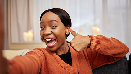 Image showing Selfie, black woman and thumbs up at home with a smile for success, motivation and excited. Portrait, happy and African female person in a living room with a like, yes and emoji hand sign at house