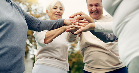 Image showing Hands stacked, senior and people in nature for motivation, support and team building in retirement. Excited, together and group of elderly friends with gesture for solidarity and community at a park