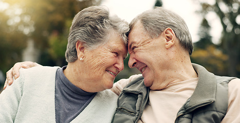 Image showing Forehead, touch and senior couple in a park with love, happy and conversation with romantic bonding. Fun, old people and elderly man embrace woman with care, romance or soulmate connection outdoor