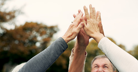 Image showing High five, partnership and a group of senior friends together in a park for motivation, success or celebration. Team building, support and community with elderly people bonding outdoor in a garden