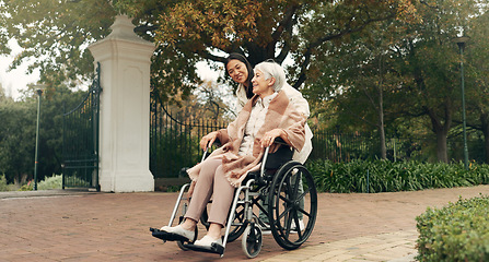 Image showing Senior woman, wheelchair and caregiver in park, nature or garden outdoor together. Happy, elderly person with a disability and walking for health, wellness and physical therapy for rehabilitation