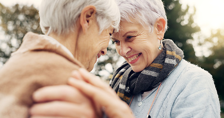 Image showing Love, connection and senior women being affection for romance and bonding on an outdoor date. Nature, commitment and elderly female couple in retirement with intimate moment in a green garden or park