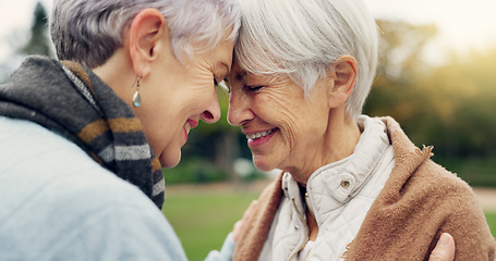 Image showing Love, connection and senior women being affection for romance and bonding on an outdoor date. Nature, commitment and elderly female couple in retirement with intimate moment in a green garden or park