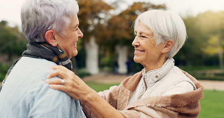 Image showing Love, care and senior women embracing for affection, romance and bonding on an outdoor date. Nature, commitment and elderly female couple in retirement hugging in a green garden or park together.