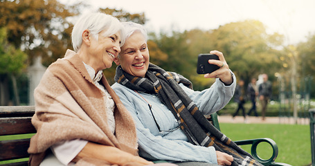 Image showing Senior, women and selfie in a park happy, bond and relax in nature on a bench together. Friends, old people and ladies smile for social media, profile picture or memory in forest chilling on weekend