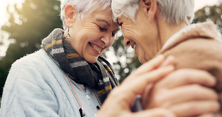 Image showing Love, connection and senior women being affection for romance and bonding on an outdoor date. Nature, commitment and elderly female couple in retirement with intimate moment in a green garden or park