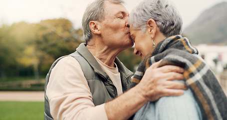 Image showing Forehead, kiss and senior couple in a park with love, happy and conversation with romantic bonding. Kissing, old people and elderly man embrace woman with care, romance or soulmate connection outdoor