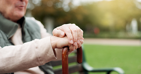 Image showing Hands, cane and elderly man in nature for walking for fresh air, exercise or peace in a park. Environment, closeup and senior male person in retirement with a stick for support in outdoor garden.