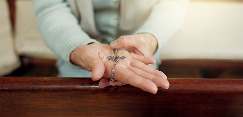 Image showing Rosary, prayer or hands of woman in church for God, holy spirit or religion with faith in Christian cathedral. Jewelry closeup, spiritual lady or person in chapel praying to praise Jesus Christ alone