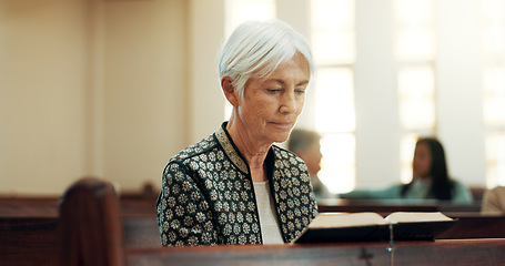 Image showing Bible, religion and a senior woman in a church for a sermon on faith or christian belief while sitting in a pew. Prayer, worship or reading with an elderly female person hearing about God and Jesus