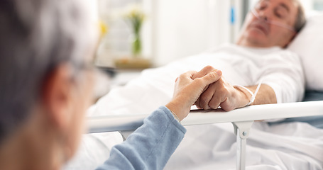 Image showing Hospital bed, love and senior couple holding hands, trust and support sick partner, husband or man with healthcare problem. Bedroom, marriage kindness and elderly woman care for mental health patient