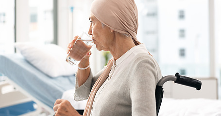 Image showing Cancer, Parkinson and elderly woman at hospital in wheelchair with water after chemotherapy or treatment. Health, elderly care and female patient with disability, sickness or disease and depression