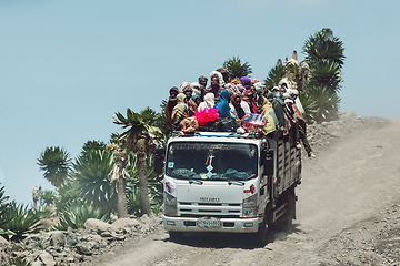 Image showing People traveling dangerously on truck