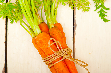 Image showing baby carrots bunch tied with rope