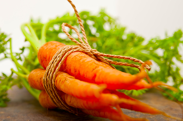 Image showing baby carrots bunch tied with rope