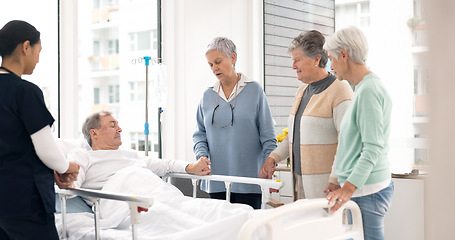 Image showing Hospital, prayer and women visit man for comfort, care and support for wellness, service and surgery. Healthcare, medical clinic and friends with patient for recovery, rehabilitation and praying